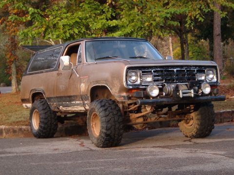 1986 Ford Bronco - Modified 1974 Dodge Ramcharger sits on large tires, ready for off-road use.