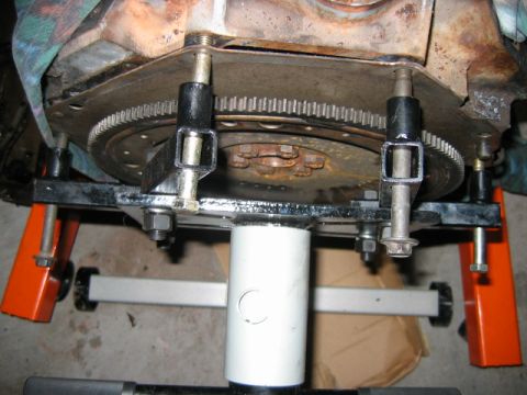 1992 Ford Bronco - This is not the way to mount the engine to the engine stand. Notice the bolts are bending they need to be shimmed out with washers and use…