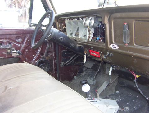 2000 Ford F-450 - Interior view of a vintage truck, showing the dashboard, steering wheel, and seating area.