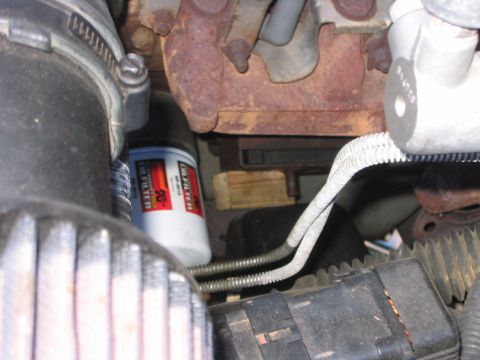 1995 Ford Bronco - Next I jammed a piece of wood between the motor mounts and the cross member, I had to “custom” make the wood, cause it was not a normal siz…