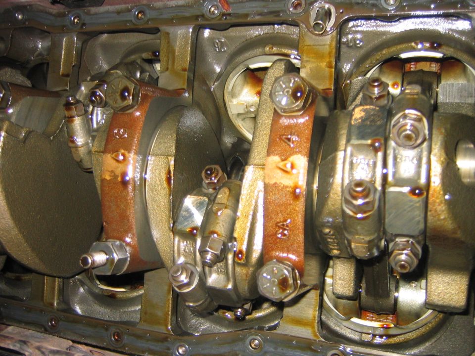 With the pan off you can inspect the bottom end of the motor, everything looked ship shape to me.  You can see where the oil pick-up attaches, it is the main bolt which is also a stud.  (If that makes sense.)
