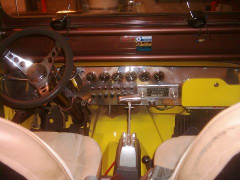 1978 Ford Bronco - Custom interior features a polished metal dashboard with multiple gauges and a prominent gear shifter.