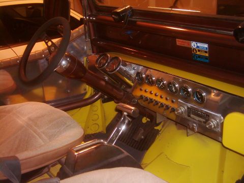 1978 Ford Bronco - Custom dashboard features numerous gauges and switches, with a floor-mounted shifter visible.