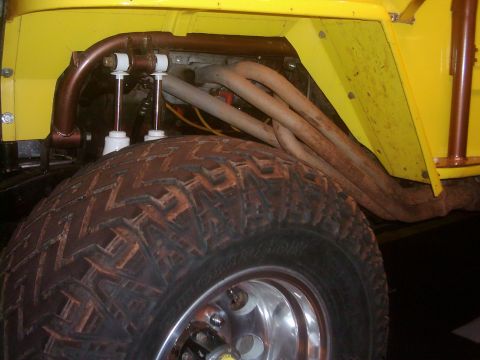 1978 Ford Bronco - This image shows the suspension and exhaust system of a modified off-road vehicle.