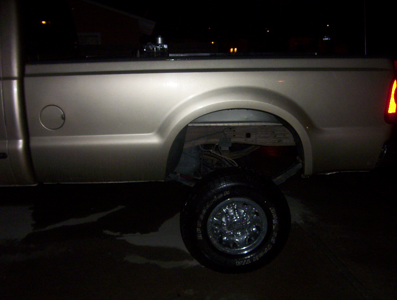2000 Ford F-450 pickup truck rear quarter panel, wheel, and taillight