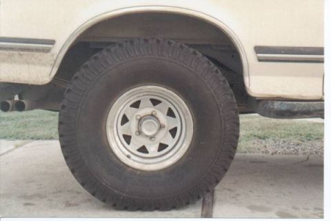 1990 Ford Bronco - Close-up of the rear wheel and fender on a 1990 Ford Bronco.
