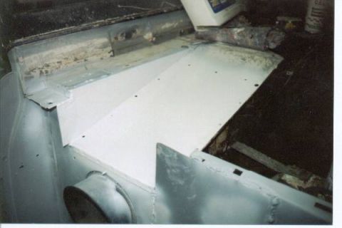 1966 Ford Bronco - The interior floor pan of a 1966 Ford Bronco shows new metalwork during a modification project.