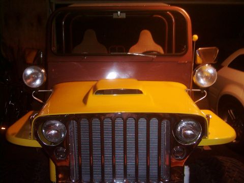 1978 Ford Bronco - This modified Jeep CJ-5 features a prominent hood scoop and a distinctive chrome grille.