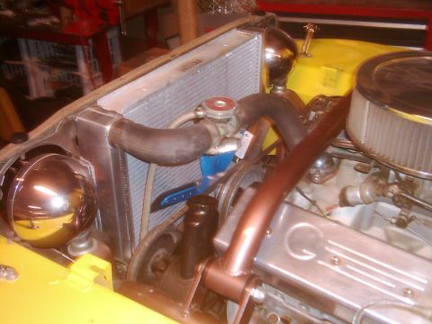 1978 Ford Bronco - The engine bay of a vehicle is shown, focusing on the radiator and associated components.