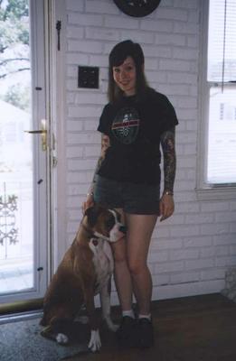 1992 Ford Bronco - A woman and her boxer dog pose for a photo indoors.