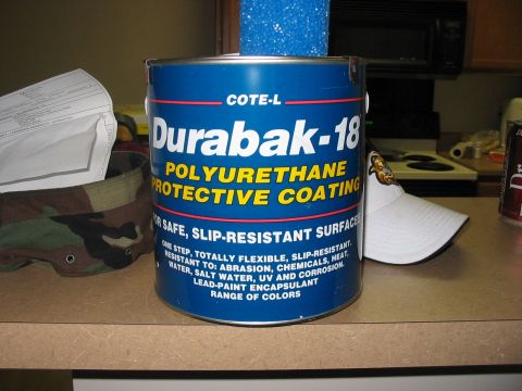 1988 Ford Bronco - A can of Durabak-18 protective coating is shown on a countertop next to some other items.