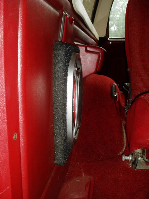1990 Ford Bronco - Interior shot of a car's red door panel with a speaker installed.