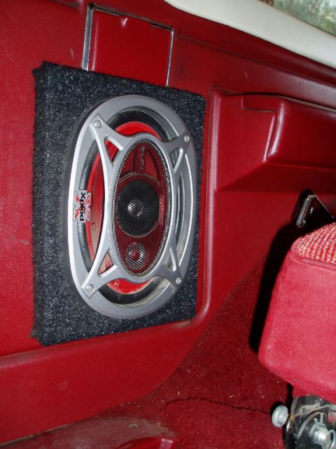 1990 Ford Bronco - Close-up of an aftermarket speaker installed in the interior of a vehicle.