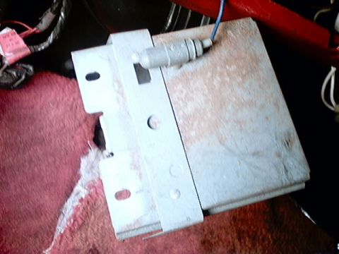 1979 Ford Bronco - Close-up of an electronic control module with visible wiring and mounting hardware.
