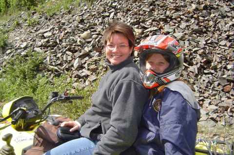1993 Ford Bronco - Two women are riding an ATV on a rocky trail.
