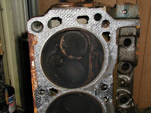 Engine cylinder head with carbon buildup in cylinders
