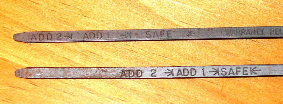 Two engine oil dipsticks compared side by side, stamped ADD 2, ADD 1 and SAFE