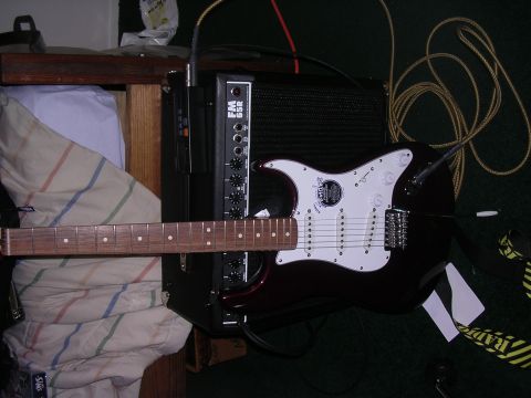 1985 Ford Bronco - An electric guitar and amplifier are set up on a carpeted floor.