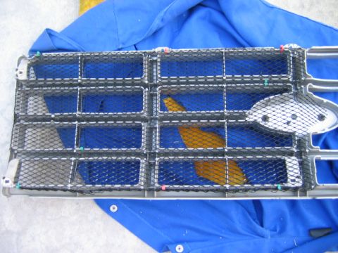 1985 Ford Bronco - This is a close-up view of a Ford Bronco grille, showing its mesh and frame details.