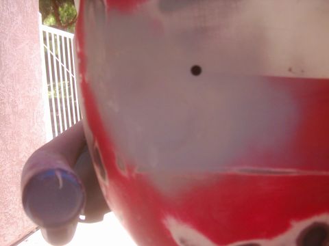 1978 Ford Bronco - Vehicle body panel undergoing paint preparation, with visible primer and filler material.