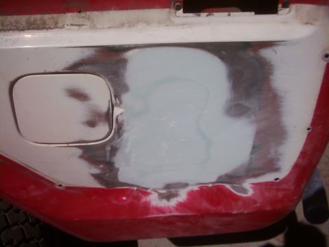 1978 Ford Bronco - This photo shows a section of a vehicle's body undergoing repair, with body filler applied to a damaged area.