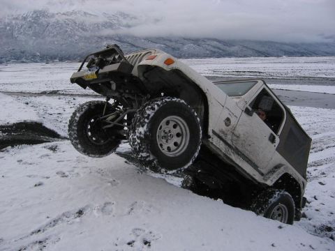 1985 Ford Bronco - Bill getting on it up and over an uncut portion of the ledge.