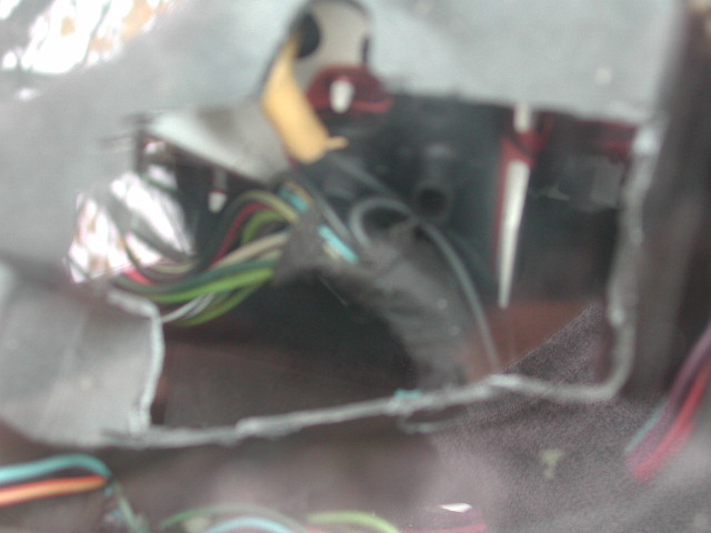 close-up of a car's wiring harness with many colorful wires