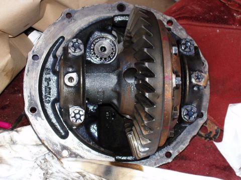 1985 Ford Bronco - Close-up view of a vehicle's open differential assembly, showing internal gears and components.