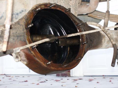 1985 Ford Bronco - Close-up of a vehicle's differential housing, revealing internal components and signs of age.