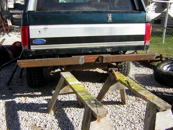 1992 Ford Bronco rear with custom bumper fabrication in progress on sawhorses