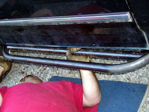 Side step bars on black vehicle