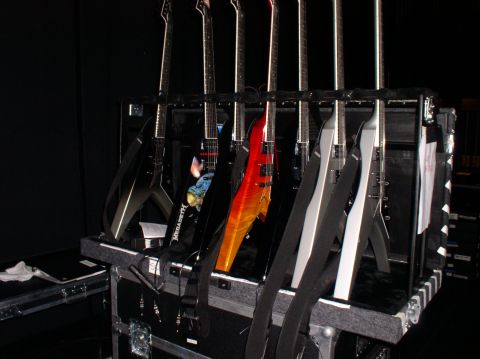 1990 Ford Bronco - A collection of electric guitars are organized and stored in a black case, ready for transport or use.