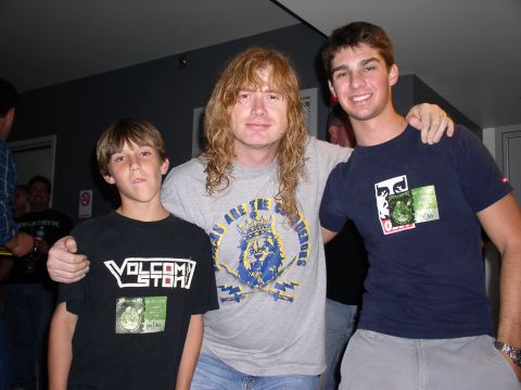 1990 Ford Bronco - Dave Mustaine poses with two younger individuals, one wearing a Volcom t-shirt.