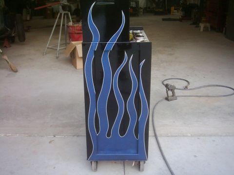 1978 Ford Bronco - Tool chest with flame graphics, likely in a garage or workshop setting.