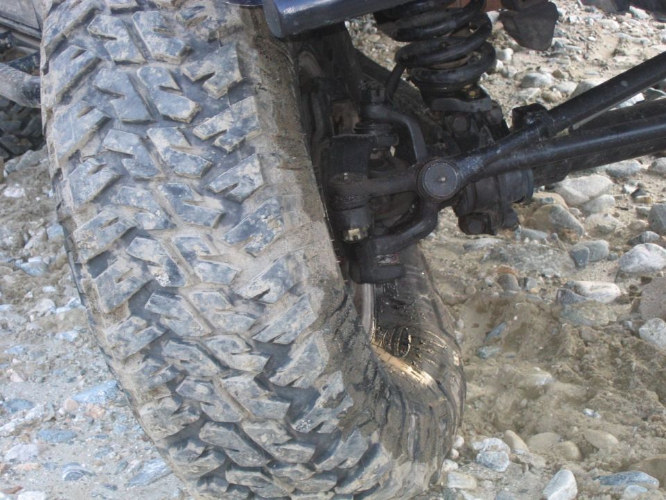 Off-road tire and suspension on rocky terrain