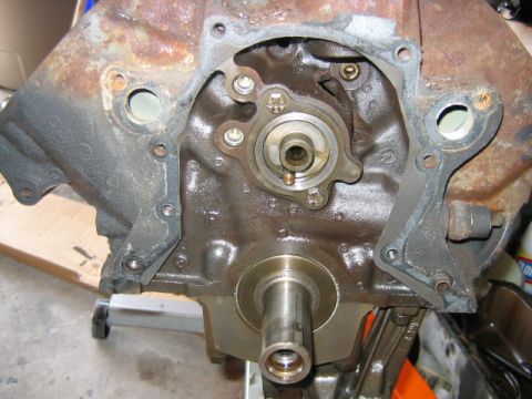 1992 Ford Bronco - Front face of an engine block with the timing cover removed, showing the camshaft gear/thrust plate area and the crankshaft snout protrudin…
