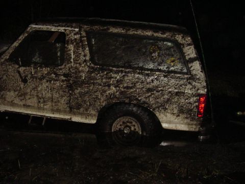1989 Ford Bronco - Muddy 1989 Ford Bronco seen off-road at night.