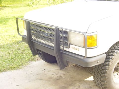 1989 Ford Bronco - Front view of a 1989 Ford Bronco, showing the brush guard and 4x4 badging.