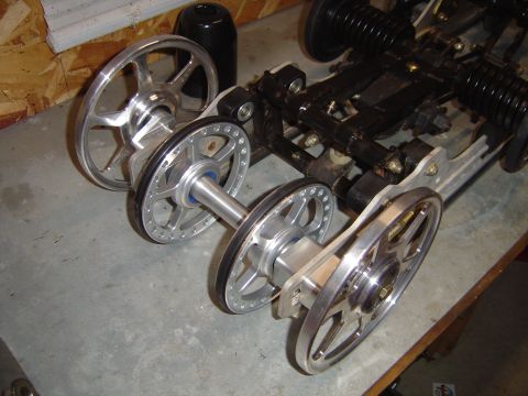 1978 Ford Bronco - Close-up of a snowmobile's rear suspension and track drive components.