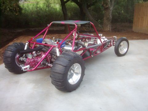 1978 Ford Bronco - This custom dune buggy features a tubular frame, large rear sand tires, and a visible engine assembly.