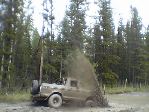 1979 Ford Bronco - this is just one of the reasons things get muddy. Tow strap attached, in case I get stuck.