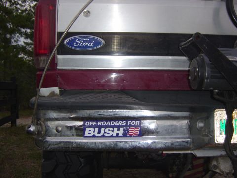 1993 Ford Bronco - The rear of a vehicle shows a Ford emblem and a "OFF-ROADERS FOR BUSH" sticker on the bumper.