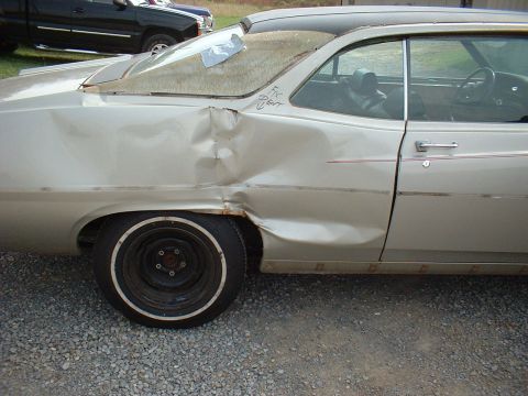 1971 Ford Torino - This vehicle has significant damage to its rear quarter panel and rear window.