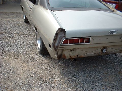 1971 Ford Torino - Rear view of a 1971 Ford Torino showing damage to the taillight and bumper area.