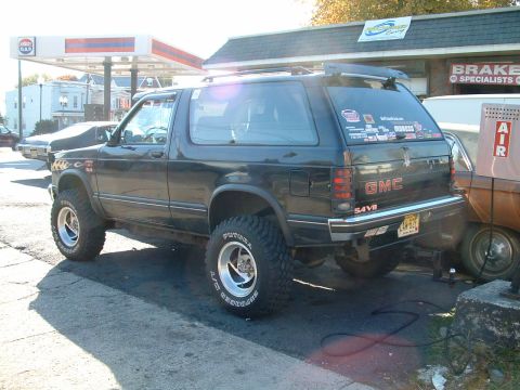1994 Ford Bronco - This GMC Jimmy SUV is modified with off-road tires and a lifted suspension.