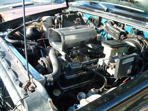 1994 Ford Bronco - Close-up of an engine bay with aftermarket performance parts installed.