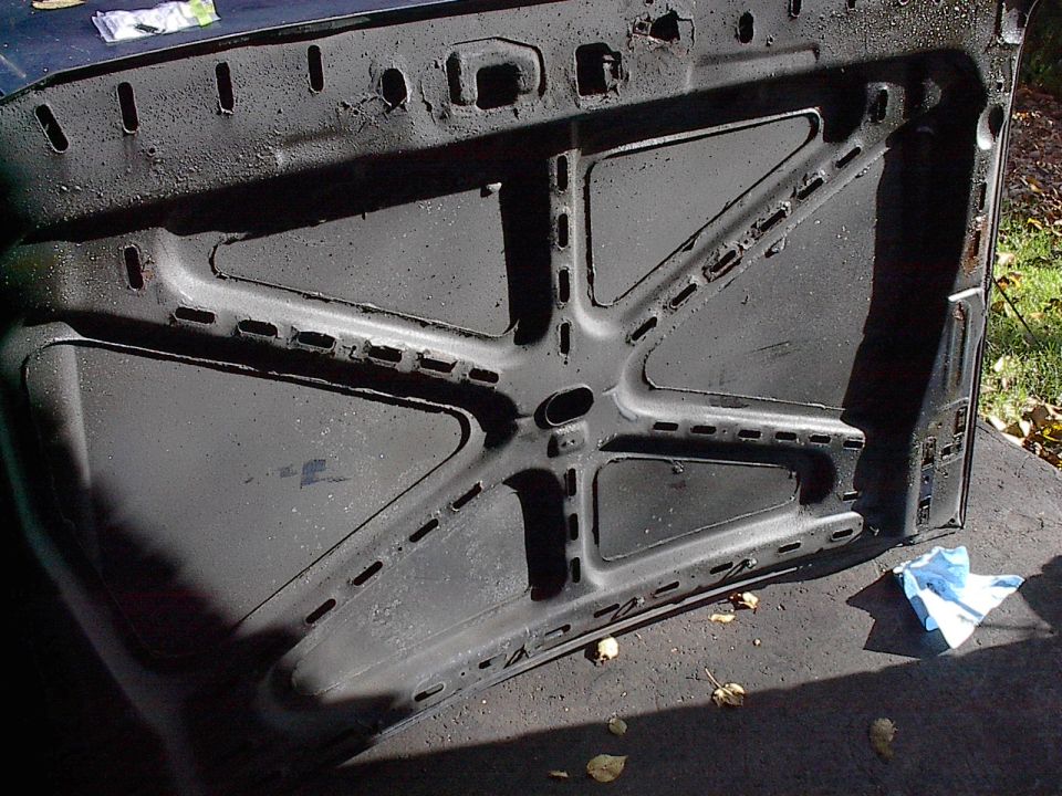 Old hood destined for junkyard. Not that bad, but enough rust starting and one or two dents to fix. Just can't justify fixing it when a new one is so cheap. Wasn't really looking forward to stripping off 27 coats of wax either. It's so deep you can't see orange peel.