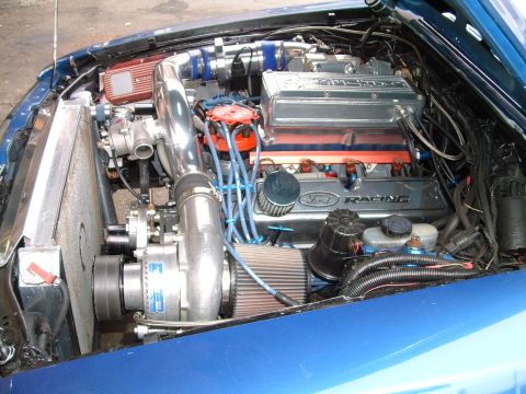 1988 Ford Mustang - Engine bay features a turbocharger and Ford Racing components.