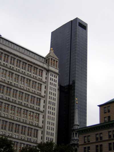1995 Ford Bronco - Urban landscape diverse architectural styles with a focus on tall buildings and a cloudy sky.