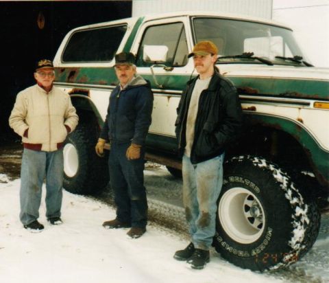 1978 Ford Bronco - Three men stand beside a weathered 1978 Ford Bronco in a snowy outdoor setting.